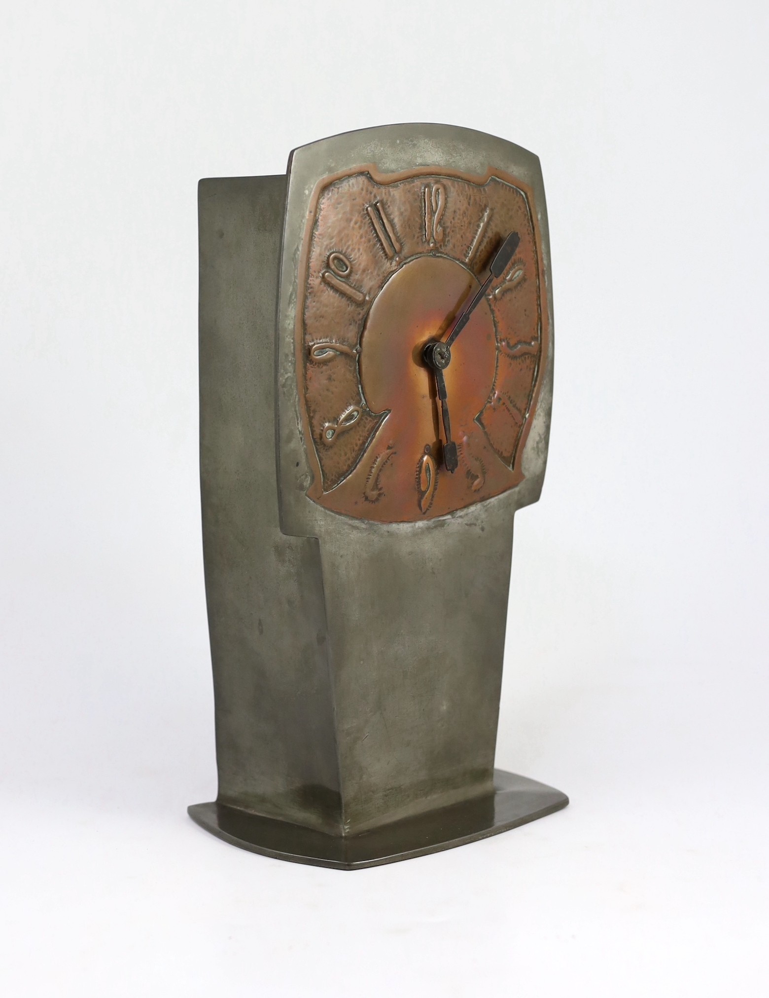 Archibald Knox for Liberty & Co., a rare ‘Tudric’ pewter and patinated copper clock, c.1902-05, model no. 0253